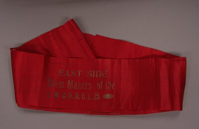 Sash, Red "East Side Dress Makers of the L.W. & D.M.U.L. 25"