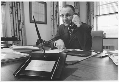 President Corson at his desk