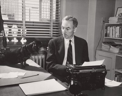 E.B. White at his New Yorker office with his dachshund Minnie
