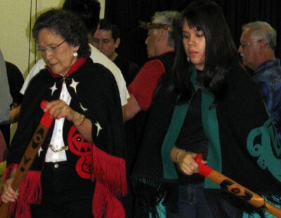 Left, Suuwayaqawilth and her granddaughter Yahmiss (Jolleen Dick) dance to a uquapiaq (paddle song), 2012. Photo by Denise Green