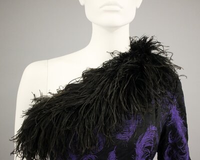 Dress, brocade with quilting and ostrich plume
