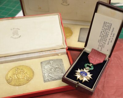 Order of the Chevalier of the Crown and other medals presented to Martha Van Rensseleaer and Flora Rose by the King and Queen of Belgium