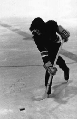 Penney Mapes skating with hockey stick in 1971-72