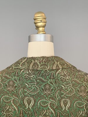 Evening coat, green and gold brocade back detail