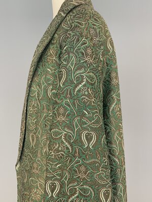 Evening coat, green and gold brocade side detail