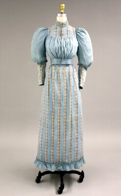 Dress B. Blue cotton dress worn by Mary Winifred Huntley (front)