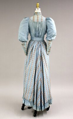 Dress B. Blue cotton dress worn by Mary Winifred Huntley (back)