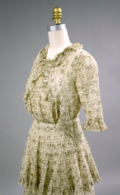 Dress D: Striped cotton/lace dress with ruffles (quarter view).