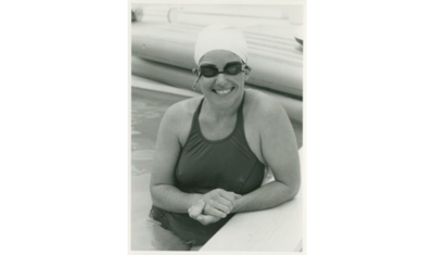 Woman smiling in swimming pool on Fire Island trip
