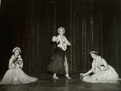 Annette Rosser, Leialoha Lund, and Lucille Coggshall performing on stage at “Costume of Many Lands” in 1938