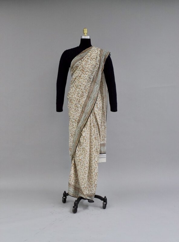 Sari paired with cable-knit sweater