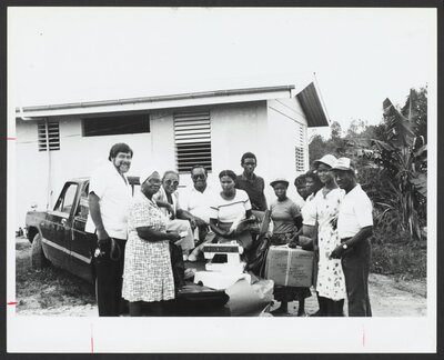 Local textile unionists, Vice President Olga Diaz, and Cecil Toppin on the island of Dominica