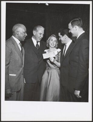 Dr. Brothers poses with check after winning The $64,000 Question. December, 1955.