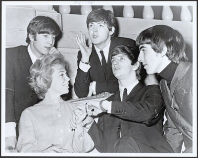 Photograph of Brothers interviewing The Beatles. February 10, 1964.
